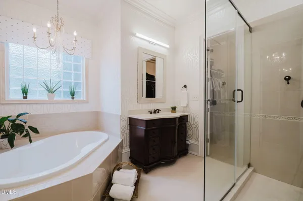 a bathroom with a shower sink and mirror