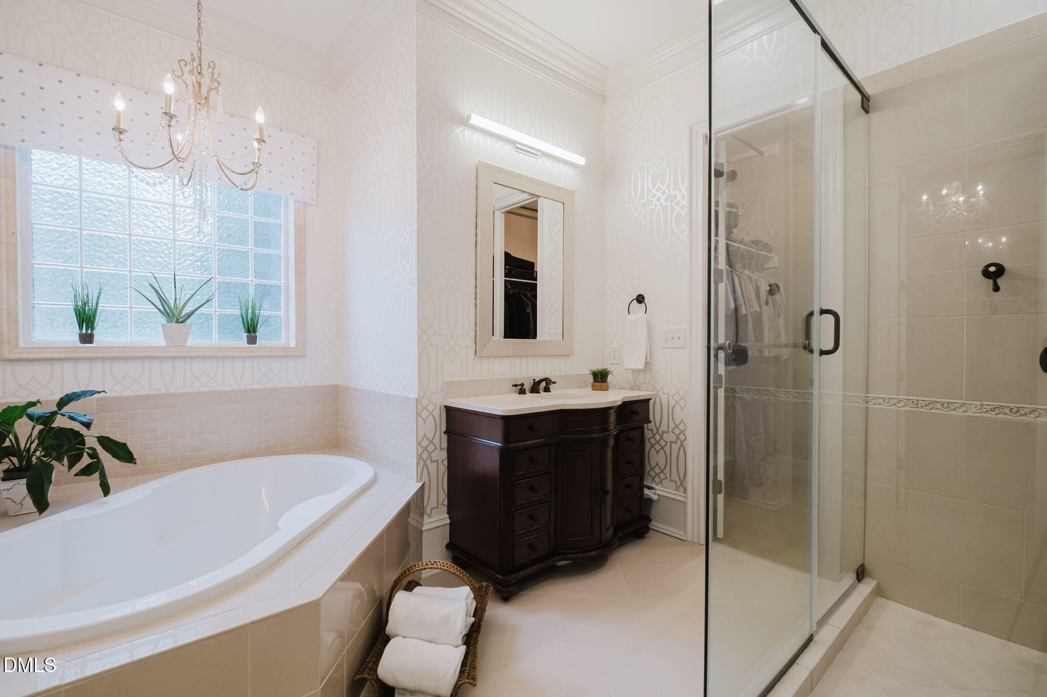 3604 Nightfall Court Raleigh, NC 27607 - Photo 38 of 79 a bathroom with a tub a sink and a large mirror