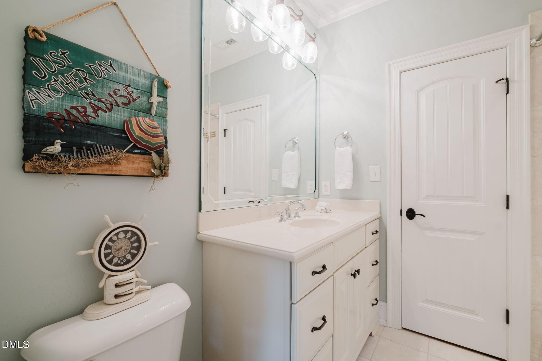 3604 Nightfall Court Raleigh, NC 27607 - Photo 49 of 79 a bathroom with a sink a toilet and a mirror