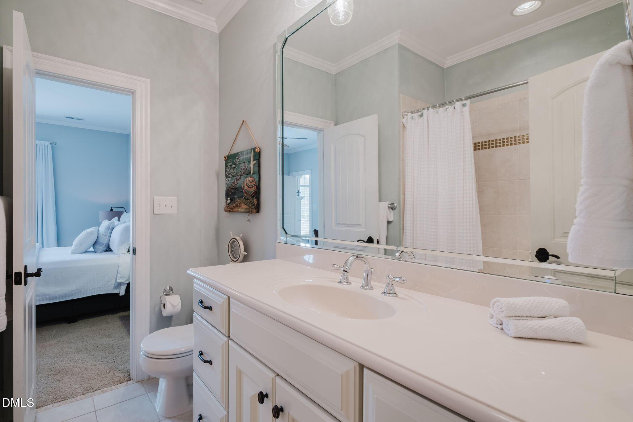 3604 Nightfall Court Raleigh, NC 27607 - Photo 50 of 79 a en suite bathroom with a sink and a mirror