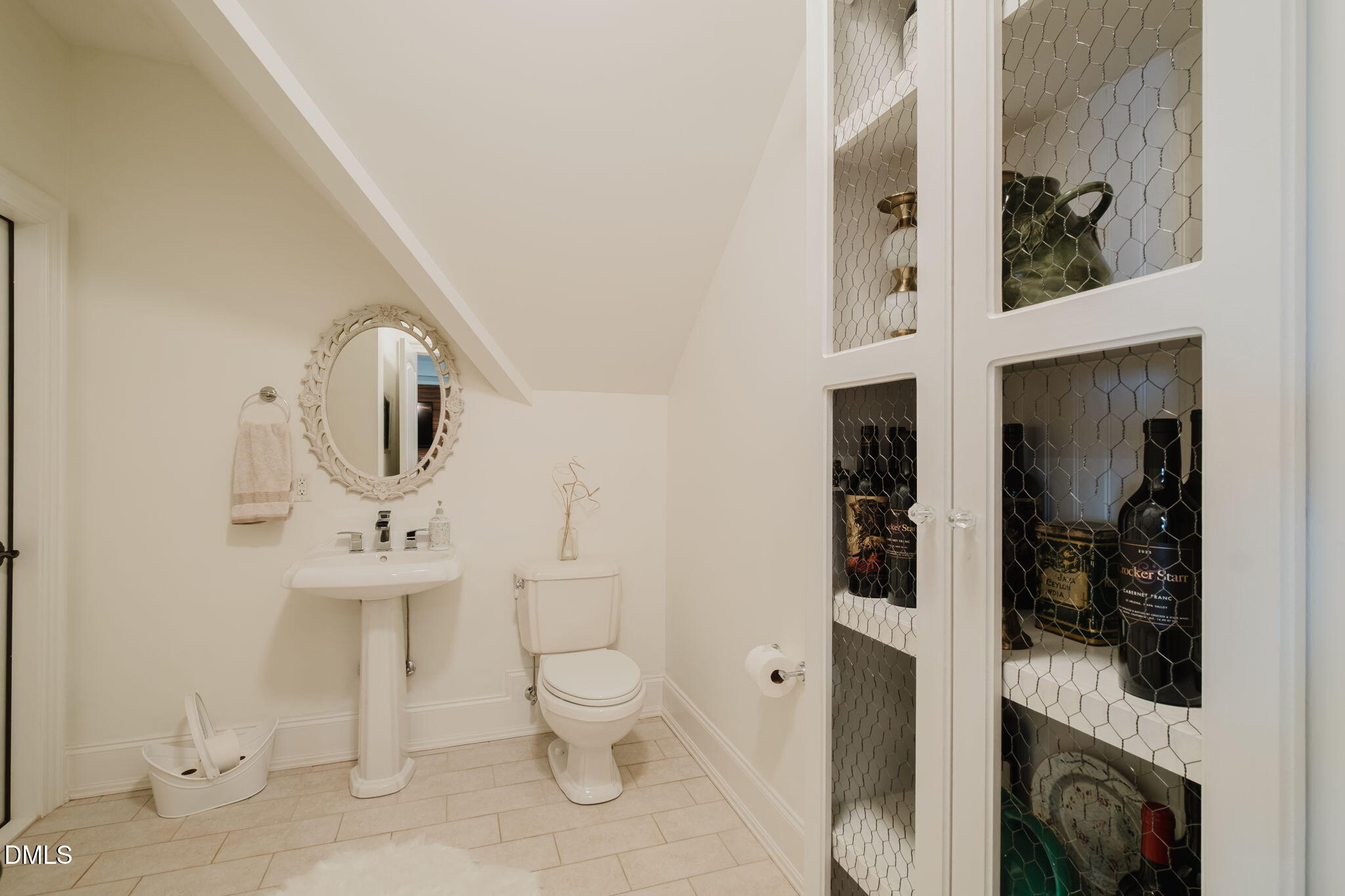3604 Nightfall Court Raleigh, NC 27607 - Photo 56 of 79 a bathroom with a toilet sink and mirror