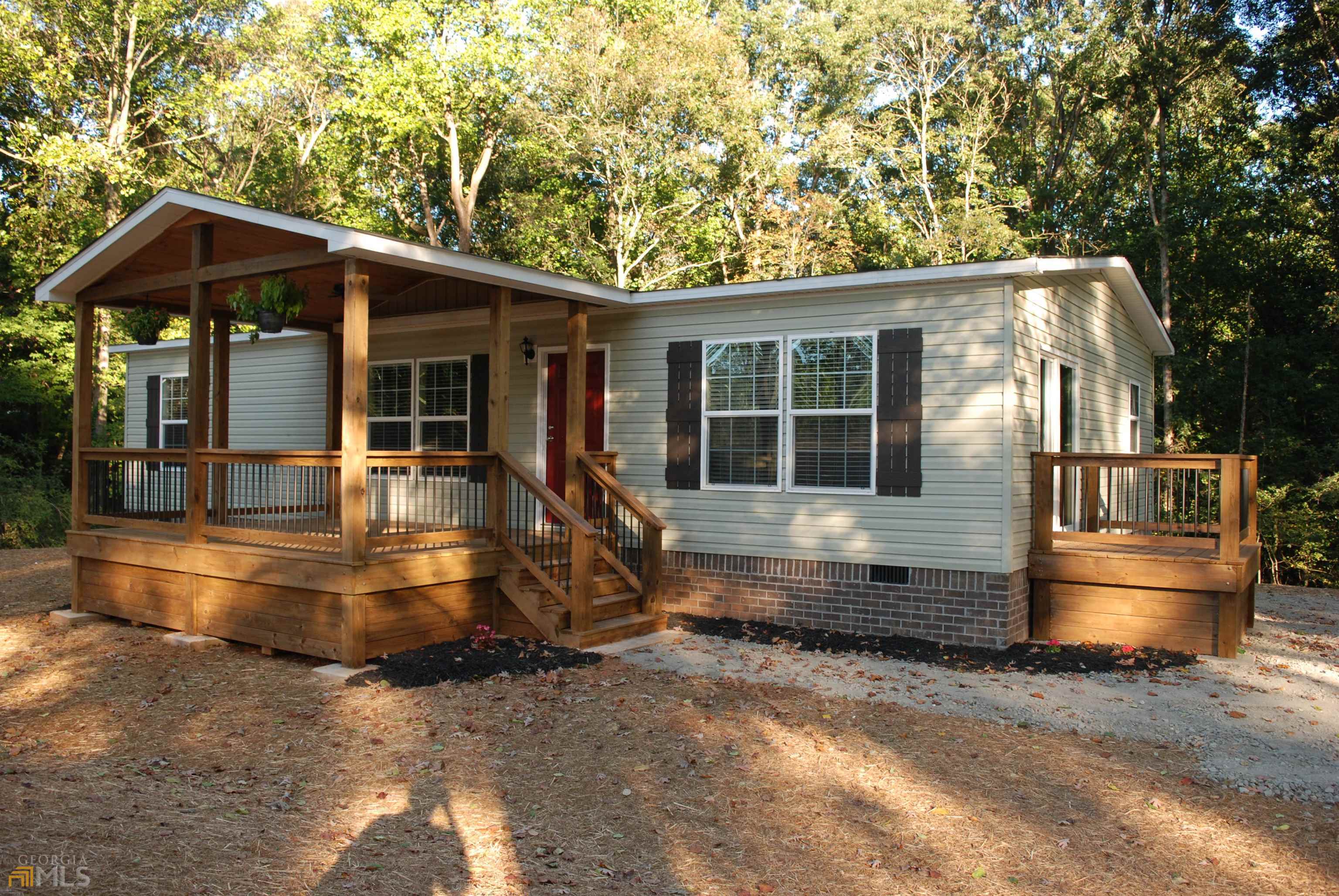 79 Hulsey Mill Road Cleveland, GA 30528 - Photo 1 of 1 an outdoor view of house with trees around