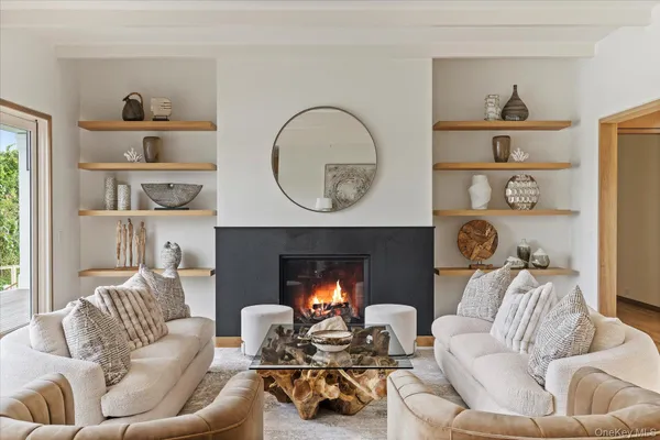 a view of a bedroom with a bed and wooden floor