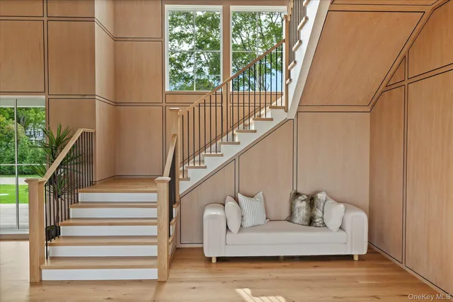 a white building with wooden floor and windows
