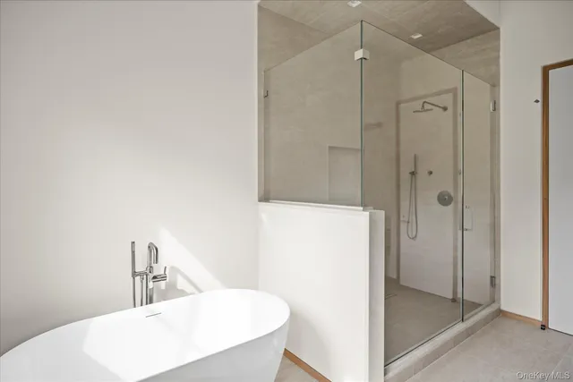 a bathroom with a shower and a sink