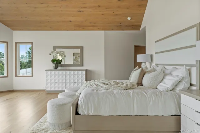 a bedroom with a large bed and a couch