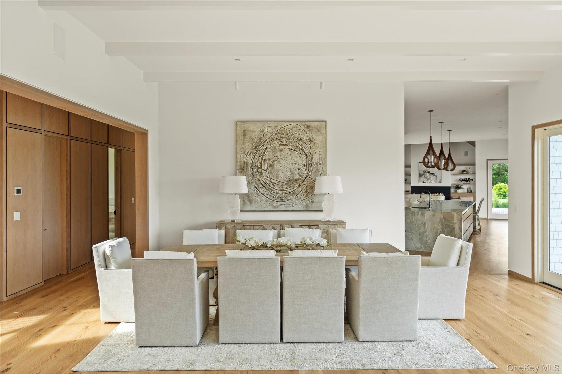 551 Main Street Quiogue, NY 11978 - Photo 8 of 50 Dining room with beamed ceiling and light wood finished floors
