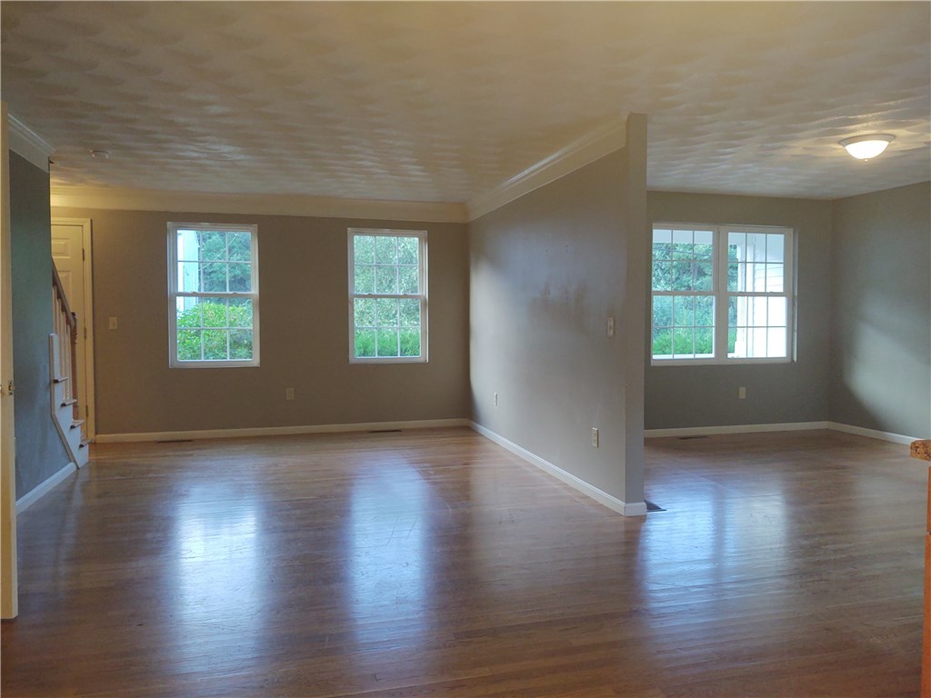 28 Hornbeam Road Coventry, RI 02816 - Photo 9 of 20 HARDWOOD FLOORS IN LIVING ROOM AND DEN
