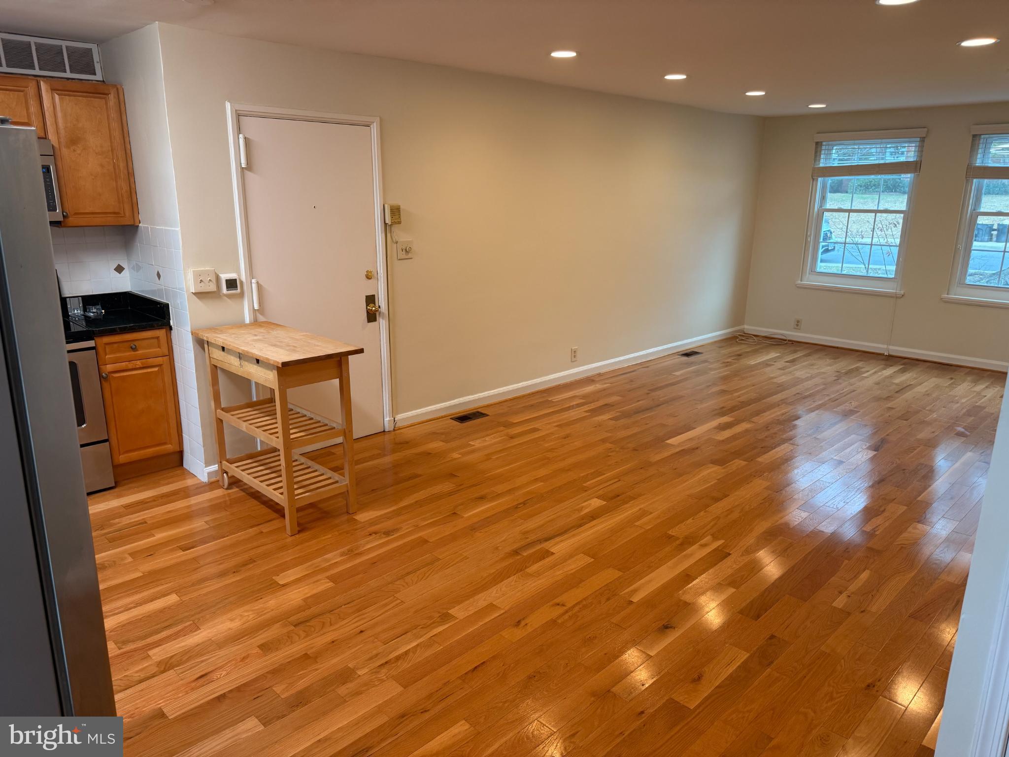 4640 31st Road South, Unit A1 Arlington, VA 22206 - Photo 15 of 15 a view of kitchen and empty room with wooden floor
