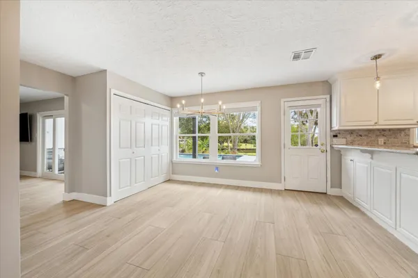 a spacious bathroom with a bathtub and toilet