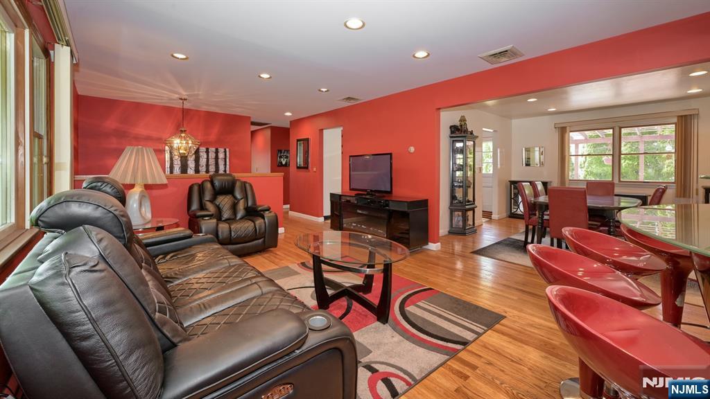 277 French Hill Road Wayne, NJ 07470 - Photo 6 of 28 a living room with furniture a rug and a large window