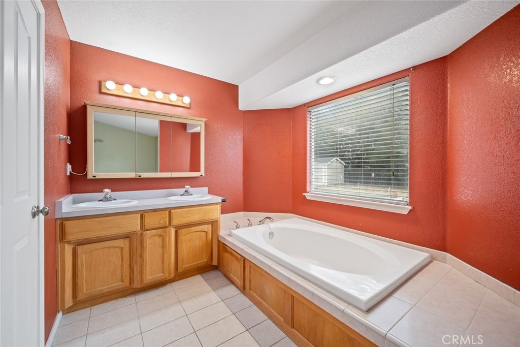 3735 Monterey Road Atascadero, CA 93422 - Photo 18 of 33 a bathroom with a tub sink and mirror