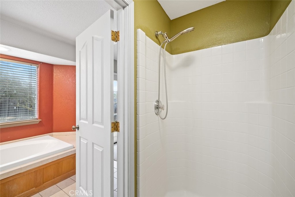 3735 Monterey Road Atascadero, CA 93422 - Photo 19 of 33 a bathroom with a bathtub and shower