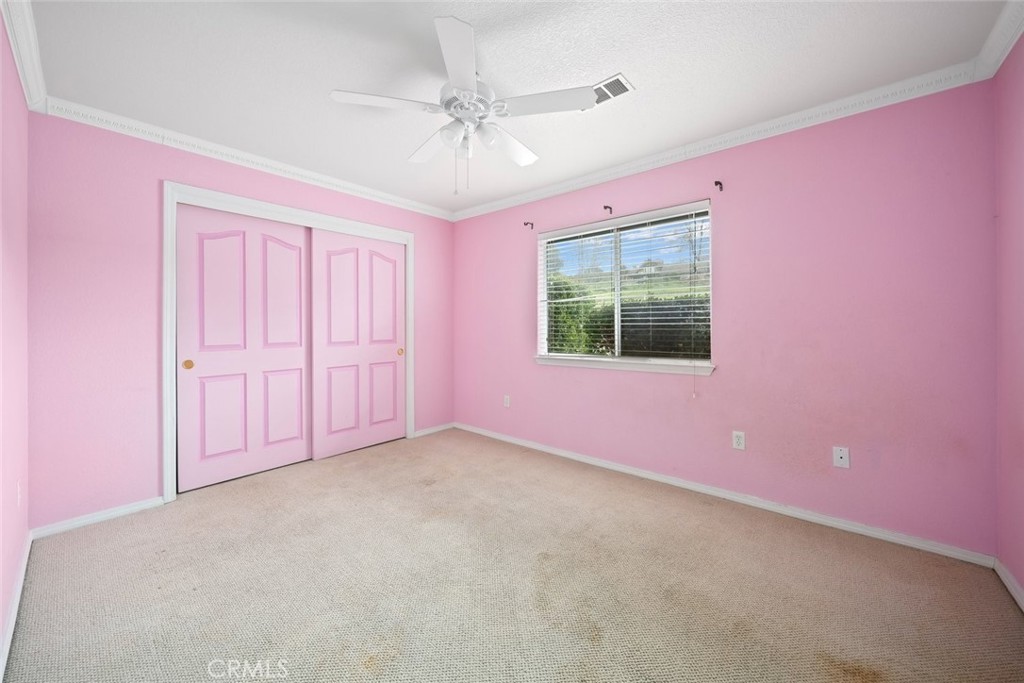 3735 Monterey Road Atascadero, CA 93422 - Photo 21 of 33 en empty room with windows and ceiling fan