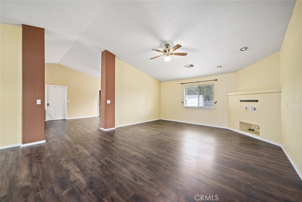 3735 Monterey Road Atascadero, CA 93422 - Photo 3 of 33 a view of an empty room with a window and wooden floor