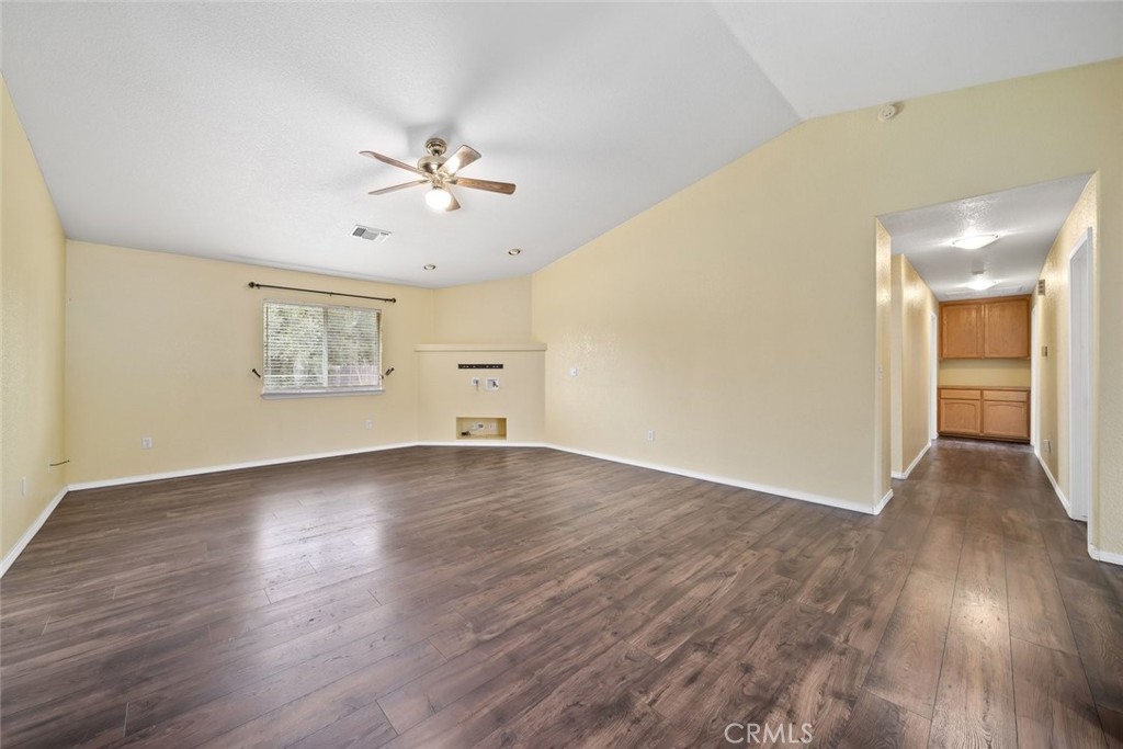 3735 Monterey Road Atascadero, CA 93422 - Photo 4 of 33 an empty room with wooden floor and windows