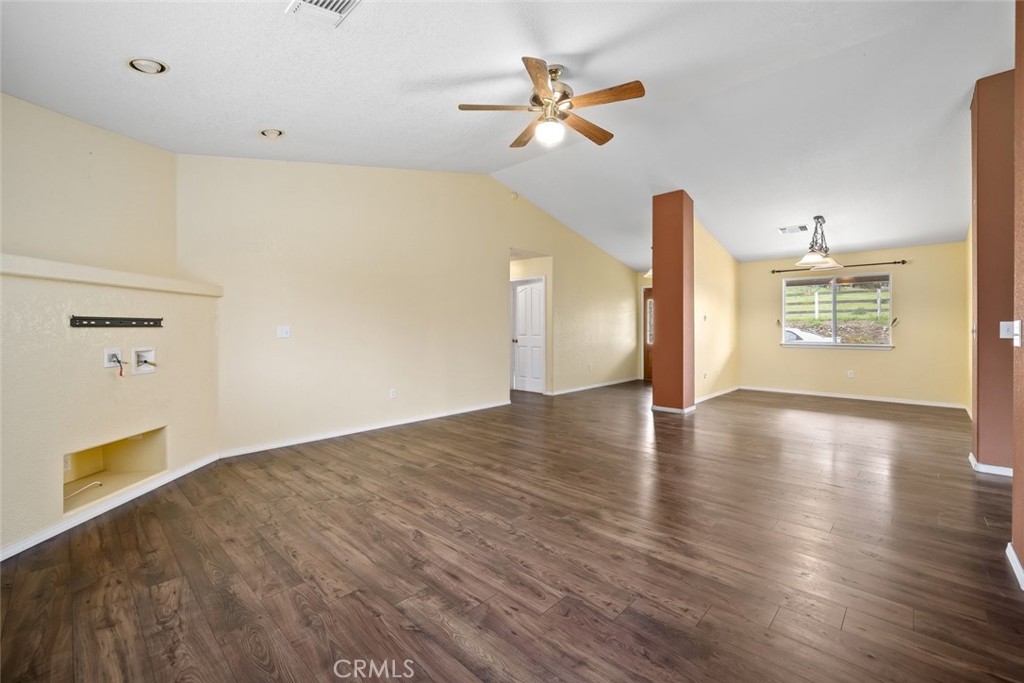 3735 Monterey Road Atascadero, CA 93422 - Photo 5 of 33 a view of an empty room with a window and wooden floor