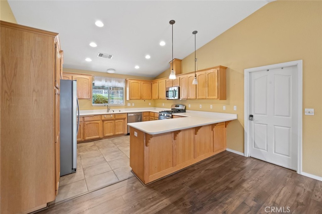 3735 Monterey Road Atascadero, CA 93422 - Photo 7 of 33 a kitchen with a sink a window stainless steel appliances and cabinets