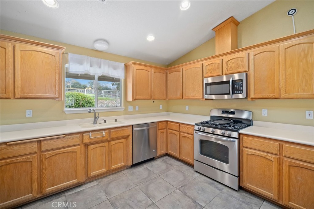 3735 Monterey Road Atascadero, CA 93422 - Photo 8 of 33 a kitchen with cabinets appliances a sink and a window