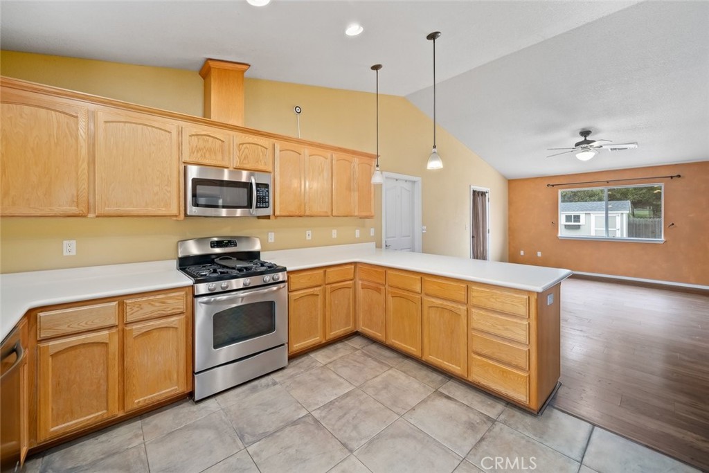 3735 Monterey Road Atascadero, CA 93422 - Photo 9 of 33 a kitchen with stainless steel appliances granite countertop a stove a sink and a refrigerator