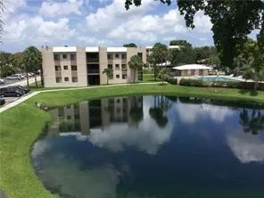 a view of a lake with a building in the background