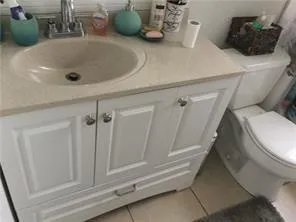 a bathroom with a sink and toilet