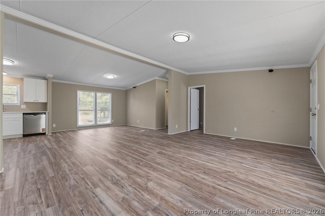 515 Mt Zion Road Red Springs, NC 28377 - Photo 15 of 50 a view of an empty room with a window and wooden floor
