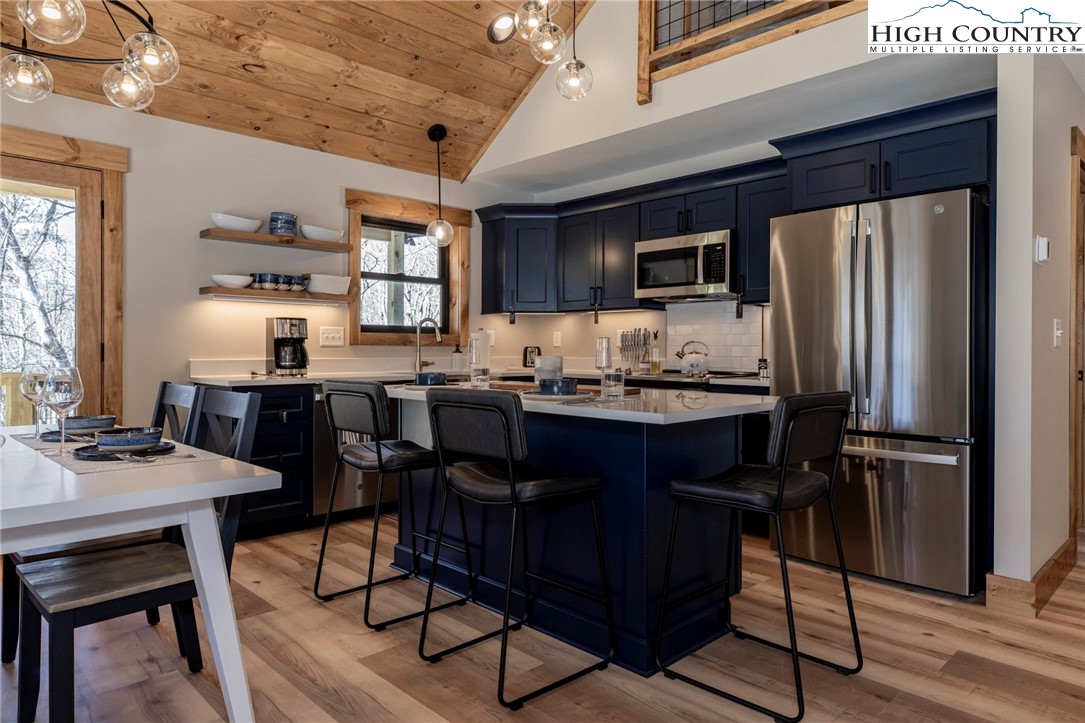 Lot 3 Old Hampton Road Boone, NC 28607 - Photo 13 of 32 a kitchen with a table chairs refrigerator and cabinets