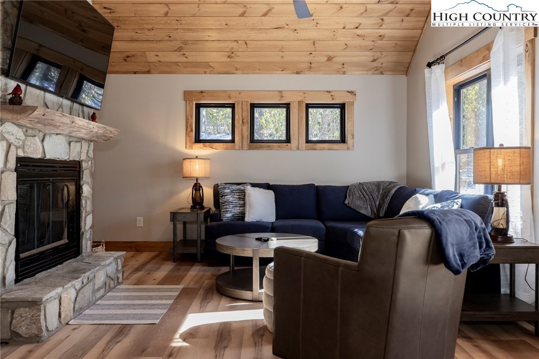 Lot 3 Old Hampton Road Boone, NC 28607 - Photo 14 of 32 a living room with furniture a fireplace and a table
