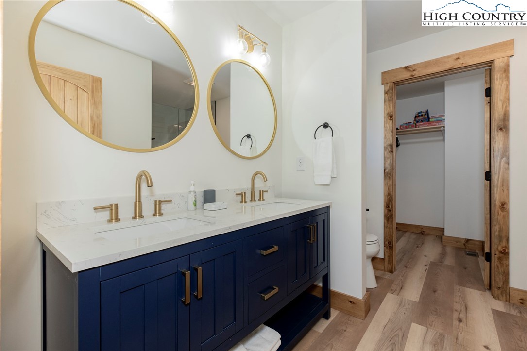 Lot 3 Old Hampton Road Boone, NC 28607 - Photo 18 of 32 a en suite bathroom with a double vanity sink and a mirror