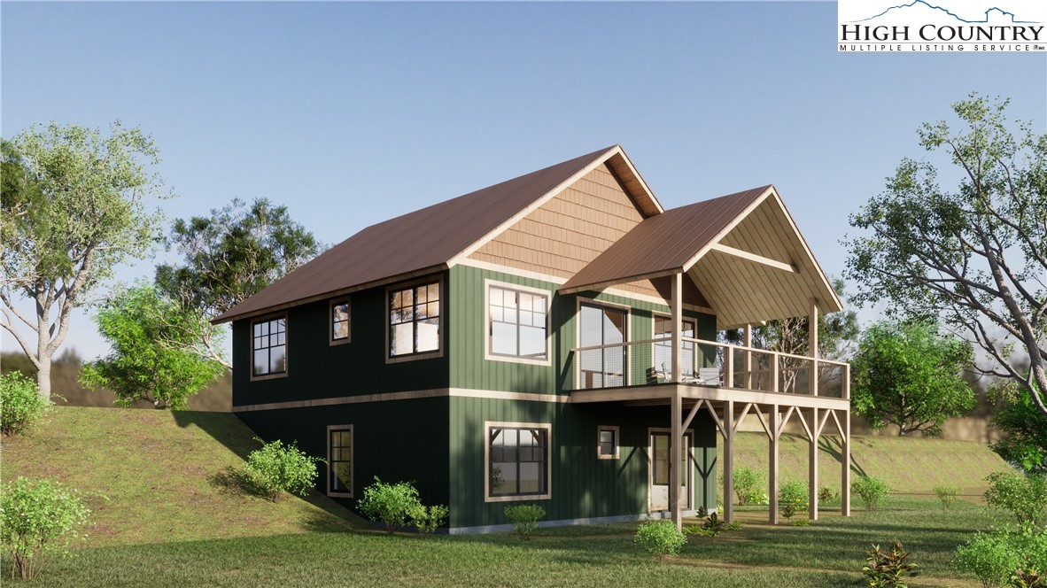 Lot 3 Old Hampton Road Boone, NC 28607 - Photo 2 of 32 a front view of a house with a garden and plants