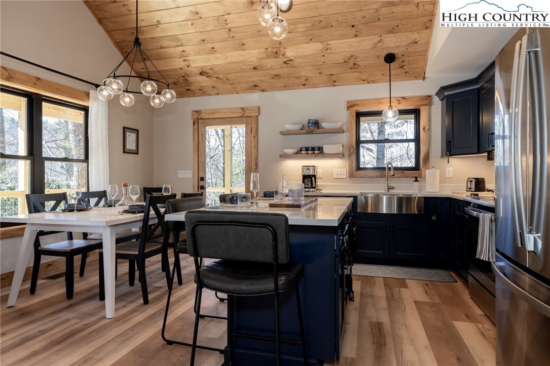 Lot 3 Old Hampton Road Boone, NC 28607 - Photo 10 of 32 a view of dining room and kitchen with a table chairs a workspace