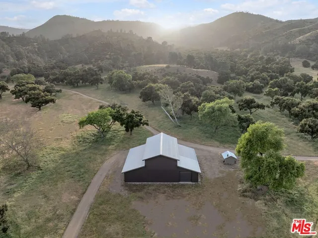 a view of lake with residential houses with outdoor space and swimming pool