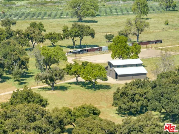 a view of a lake with a yard and mountain view
