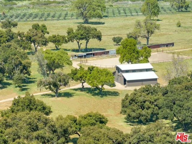 a view of a lake with a yard and mountain view
