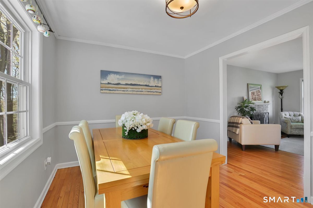 9 Academy Road Trumbull, CT 06611 - Photo 12 of 35 a view of a dining room with furniture and wooden floor