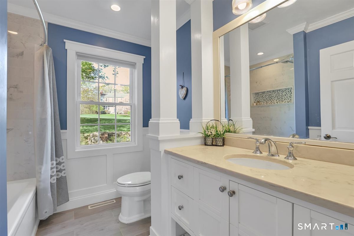 9 Academy Road Trumbull, CT 06611 - Photo 13 of 35 a bathroom with a granite countertop sink toilet and a mirror