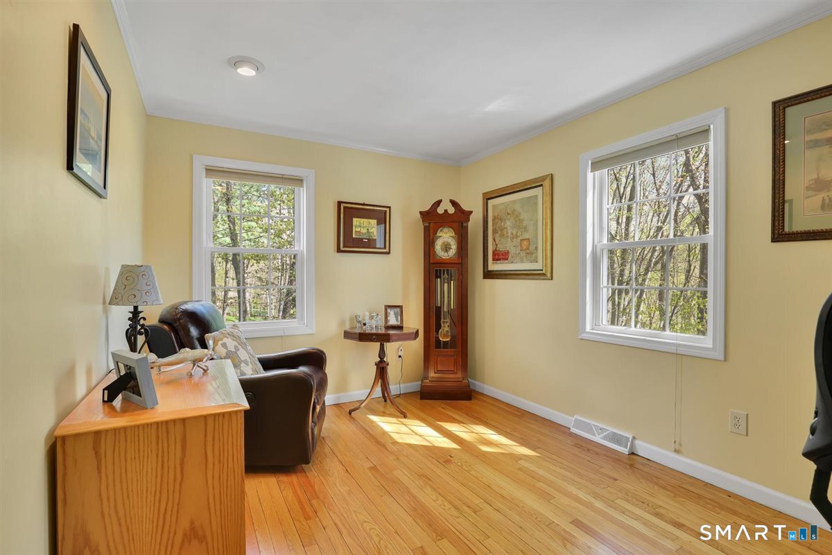 9 Academy Road Trumbull, CT 06611 - Photo 16 of 35 a view of a workspace with wooden floor and a window