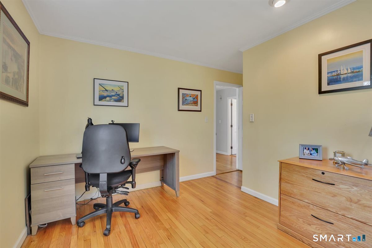 9 Academy Road Trumbull, CT 06611 - Photo 17 of 35 a view of a workspace with furniture and wooden floor