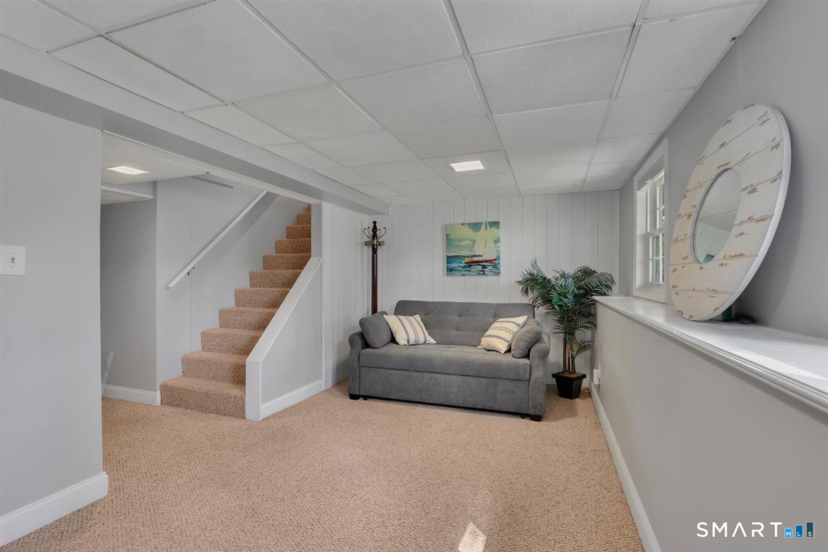 9 Academy Road Trumbull, CT 06611 - Photo 20 of 35 a living room with furniture and a large window