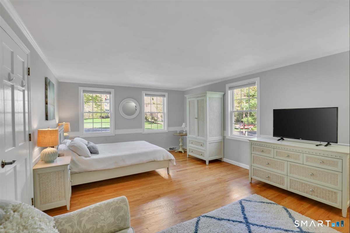 9 Academy Road Trumbull, CT 06611 - Photo 26 of 35 a bedroom with furniture and flat screen tv