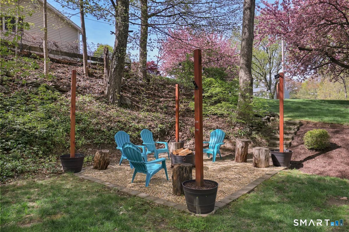9 Academy Road Trumbull, CT 06611 - Photo 30 of 35 a view of a chair and table in backyard of the house