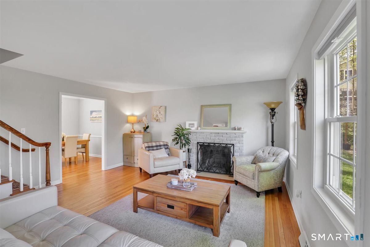 9 Academy Road Trumbull, CT 06611 - Photo 4 of 35 a living room with furniture and a fireplace