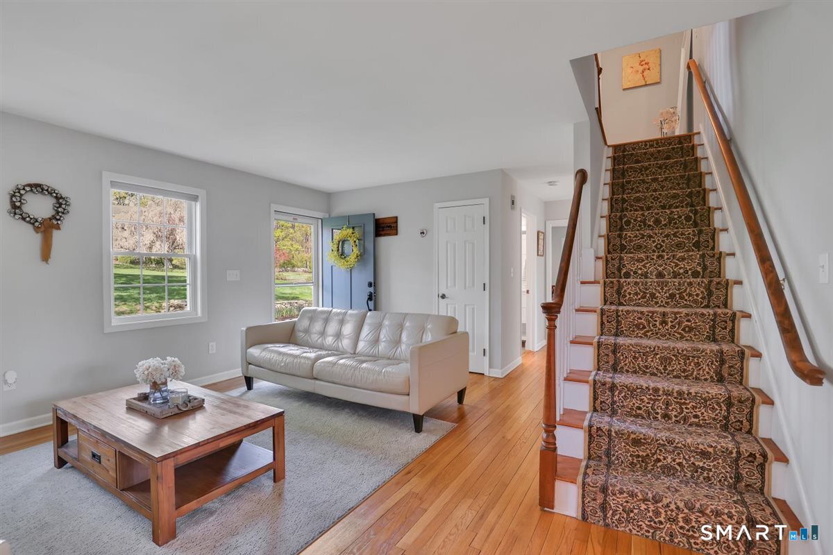 9 Academy Road Trumbull, CT 06611 - Photo 5 of 35 a living room with furniture and a wooden floor