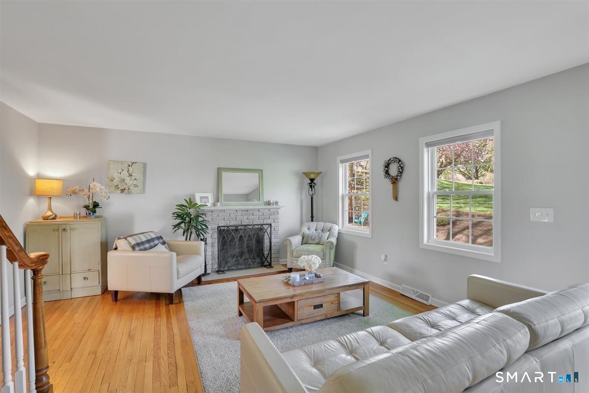 9 Academy Road Trumbull, CT 06611 - Photo 6 of 35 a bedroom with a bed and a fireplace