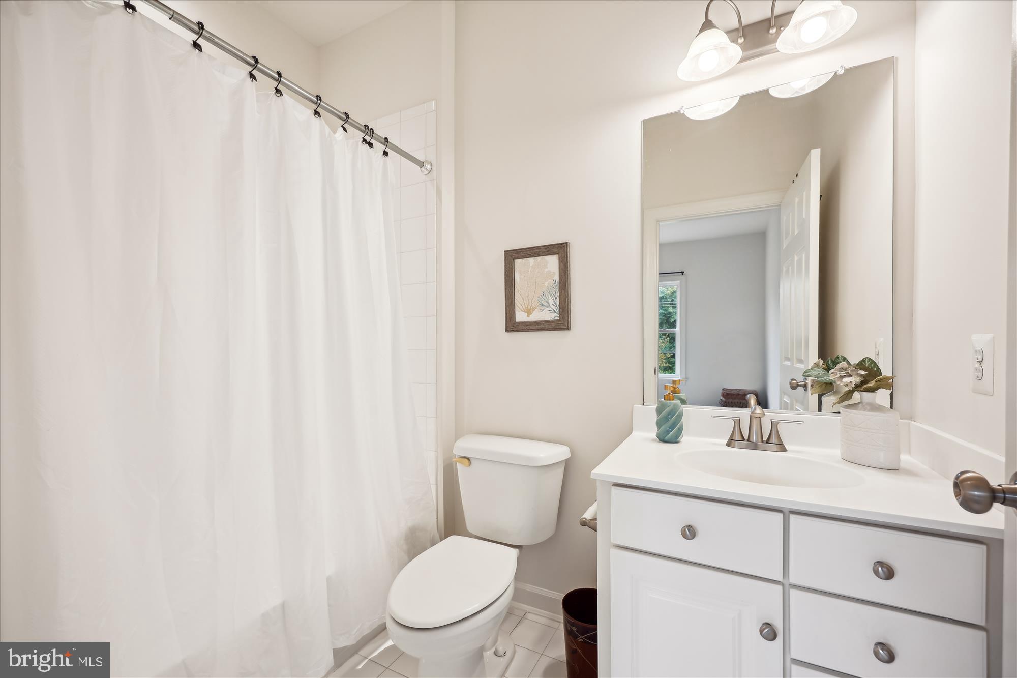 7321 Brink Road Laytonsville, MD 20882 - Photo 29 of 55 a bathroom with a toilet a sink and a mirror