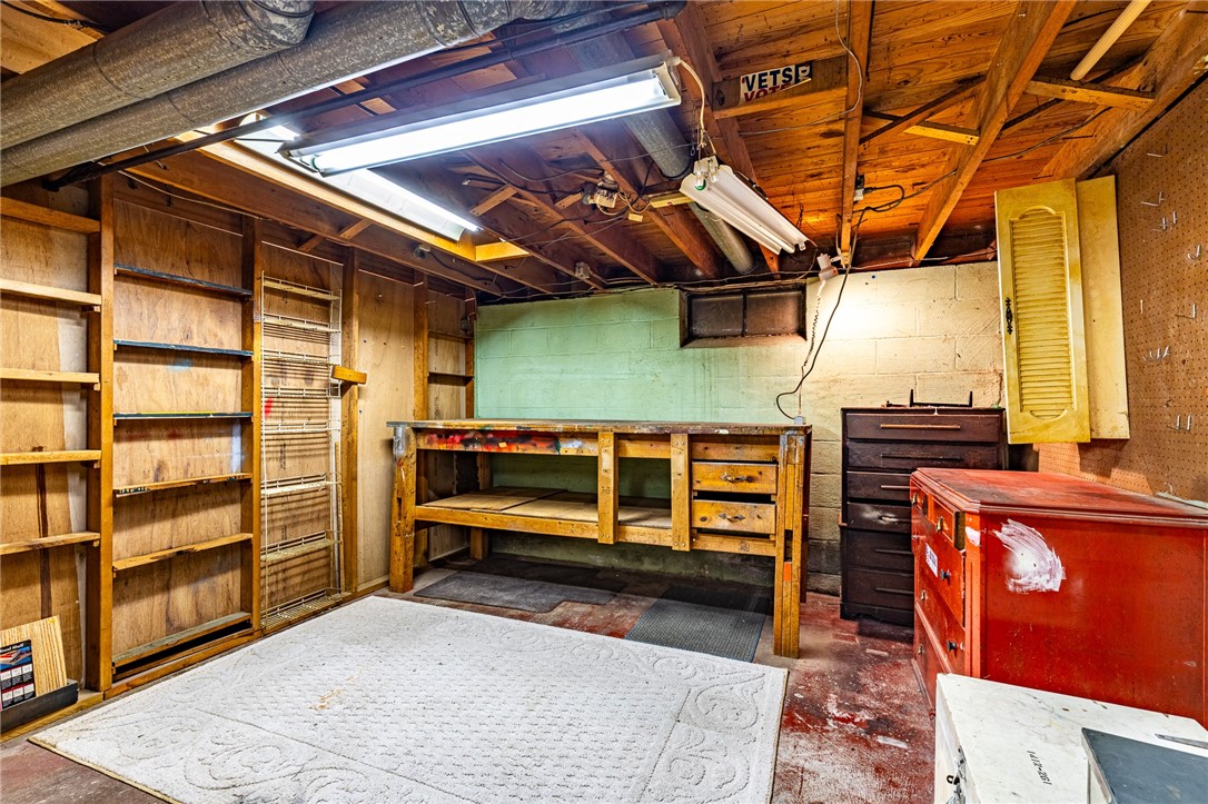 274 Parkview Drive Rochester, NY 14625 - Photo 34 of 41 Workshop area with bench and lots of storage for any man who loves to putter