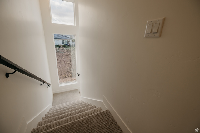 2759 Becco Trail, Unit 16 St. George, UT 84770 - Photo 26 of 42 Staircase with carpet floors and baseboards