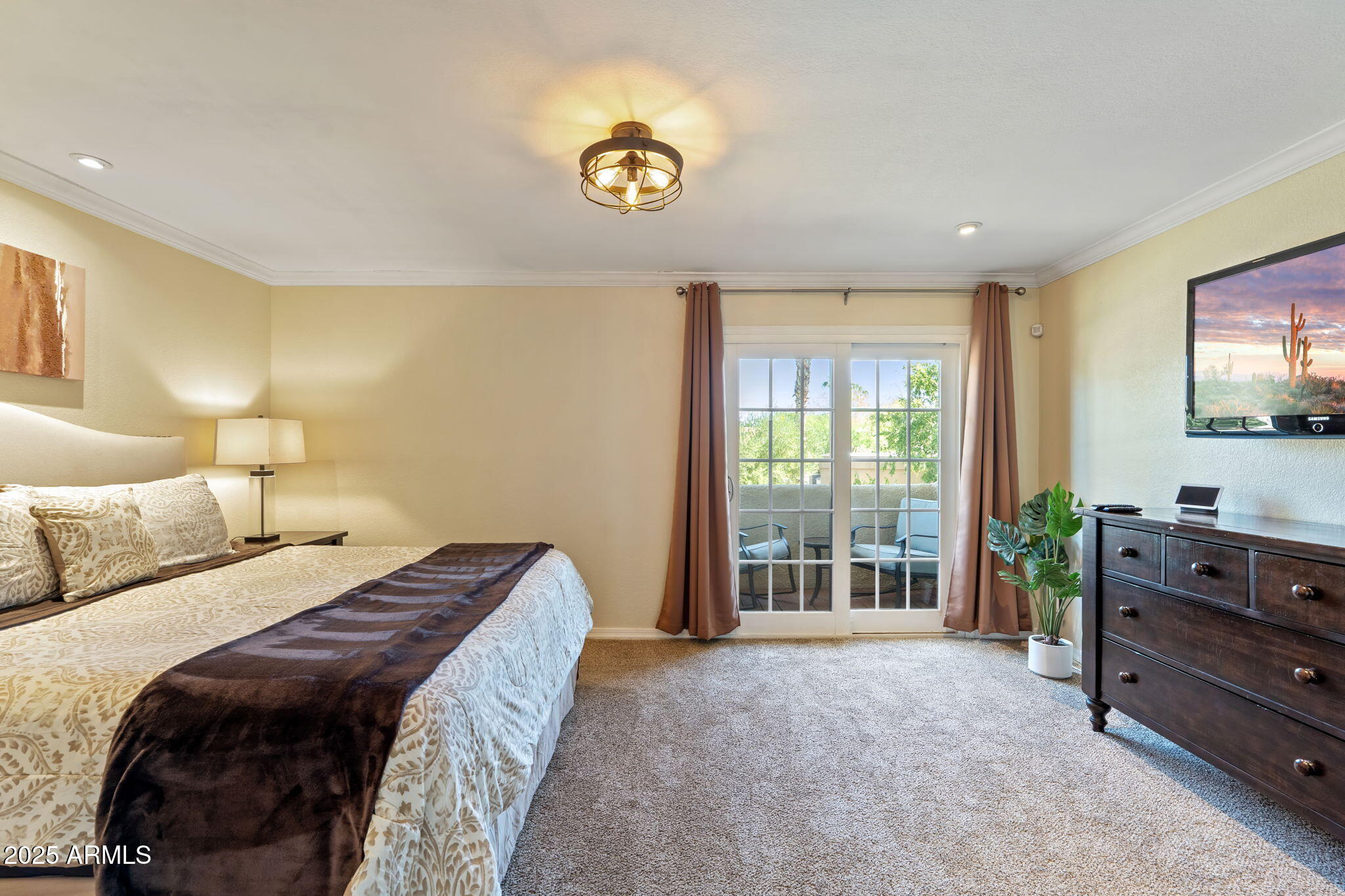6229 North 30th Way Phoenix, AZ 85016 - Photo 21 of 58 a bedroom with a bed and a flat screen tv