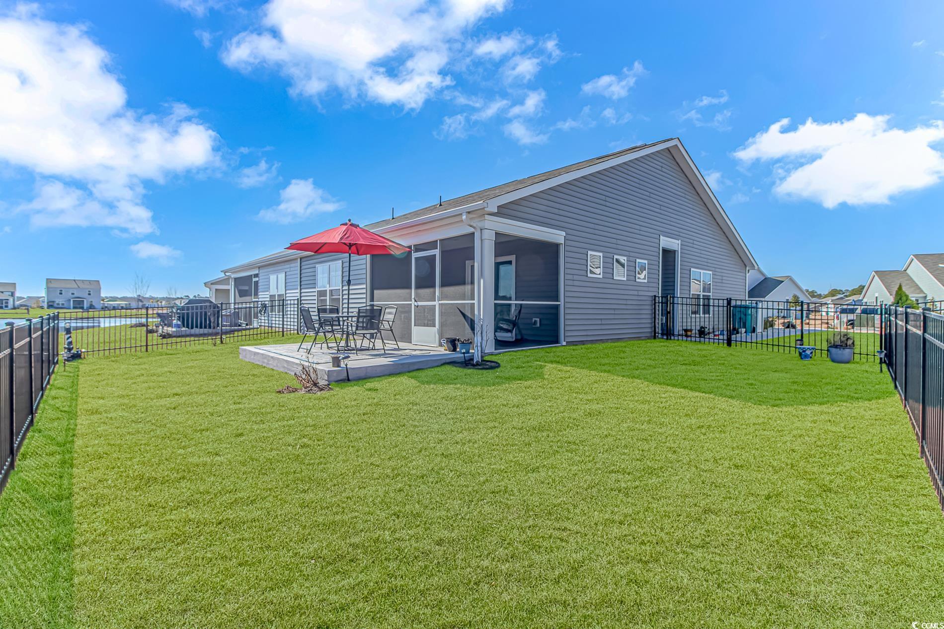 559 Courtridge Loop Conway, SC 29526 - Photo 23 of 37 Back of house with a sunroom and a yard